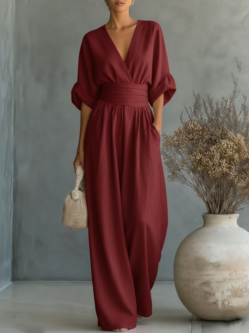 Elegante tuta con scollo a V, vita alta e gamba larga