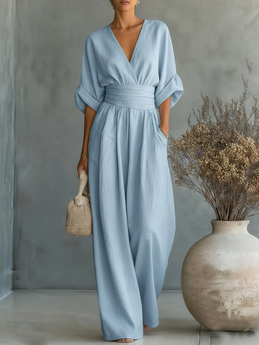 Elegante tuta con scollo a V, vita alta e gamba larga