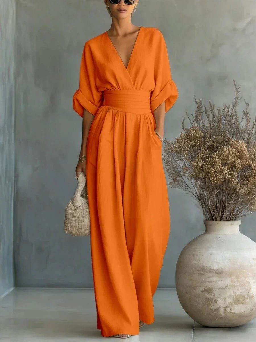 Elegante tuta con scollo a V, vita alta e gamba larga