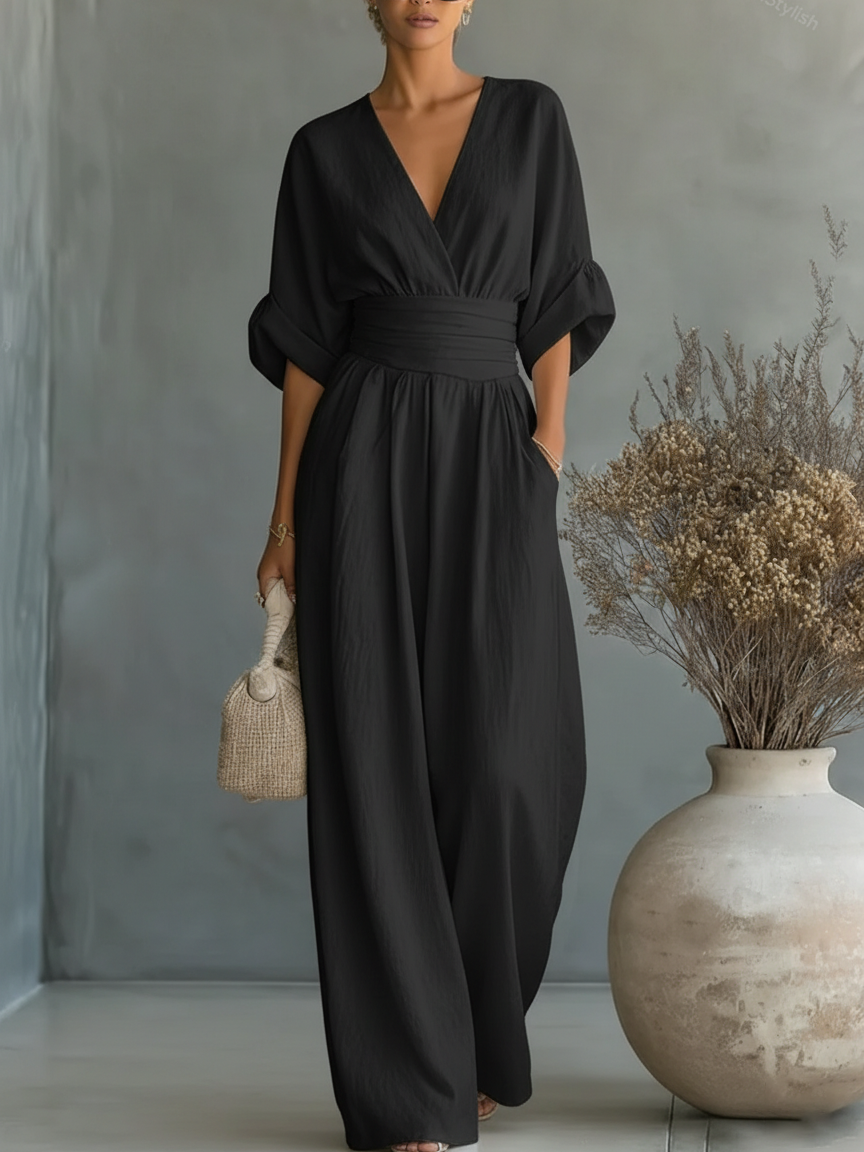 Elegante tuta con scollo a V, vita alta e gamba larga